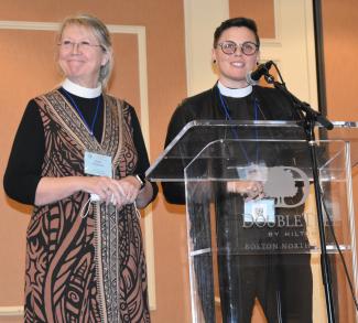 Carol Morehead and Tamra Tucker present the resolution to create a Reparations Fund.