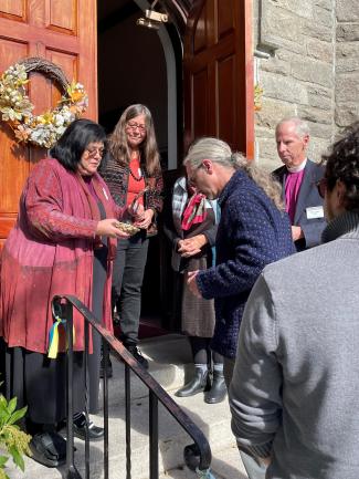Bishop Carol Gallagher offers smudging ritual