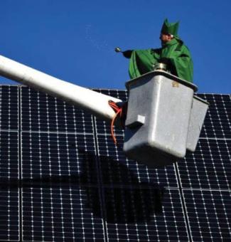 Bishop Bud Cederholm blessing solar panels at St. Andrew's Church, Framingham