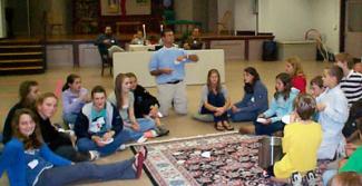 The Rev. Chris Wendell, assistant rector at St. Andrew's Church in Wellesley, leads a discussion on inequity.