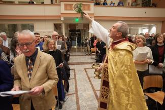 Gates sprinkling congregation