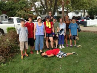 The group from the Bristol Cluster helps with yardwork in Staten Island. 