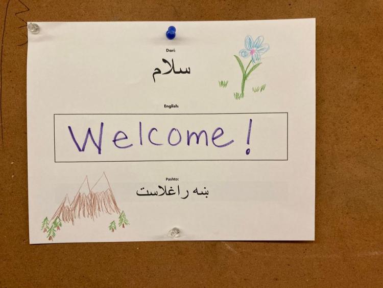 Welcome sign in English, Pashto and Dari