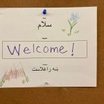 Welcome sign in English, Pashto and Dari