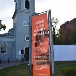 Here Lies Darby Vassall film project banner outside Christ Church in Cambridge